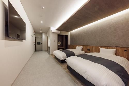 南紀月の瀬温泉ぼたん荘 - Bed